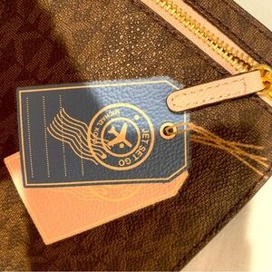Brand new, limited edition,rare/collective authentic Michael Kors travel pouch.